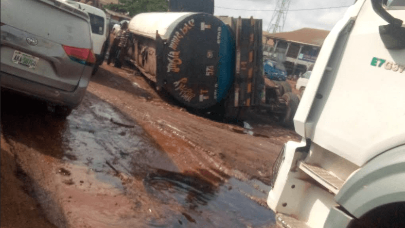 Panic as fuel tanker falls on bad Asaba-Onitsha road